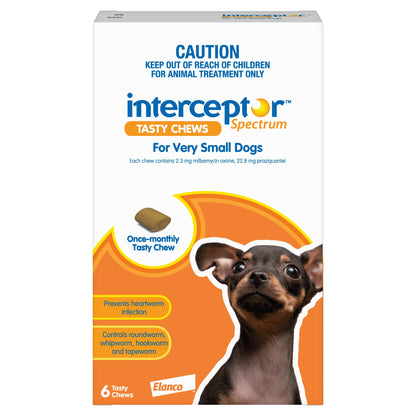 Orange and white box of Interceptor Spectrum Tasty Chews for Very Small Dogs, showing a chew and a puppy.