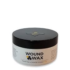 White jar of Wound Wax, a natural barrier salve for horses and dogs, with a black lid featuring a bee logo.
